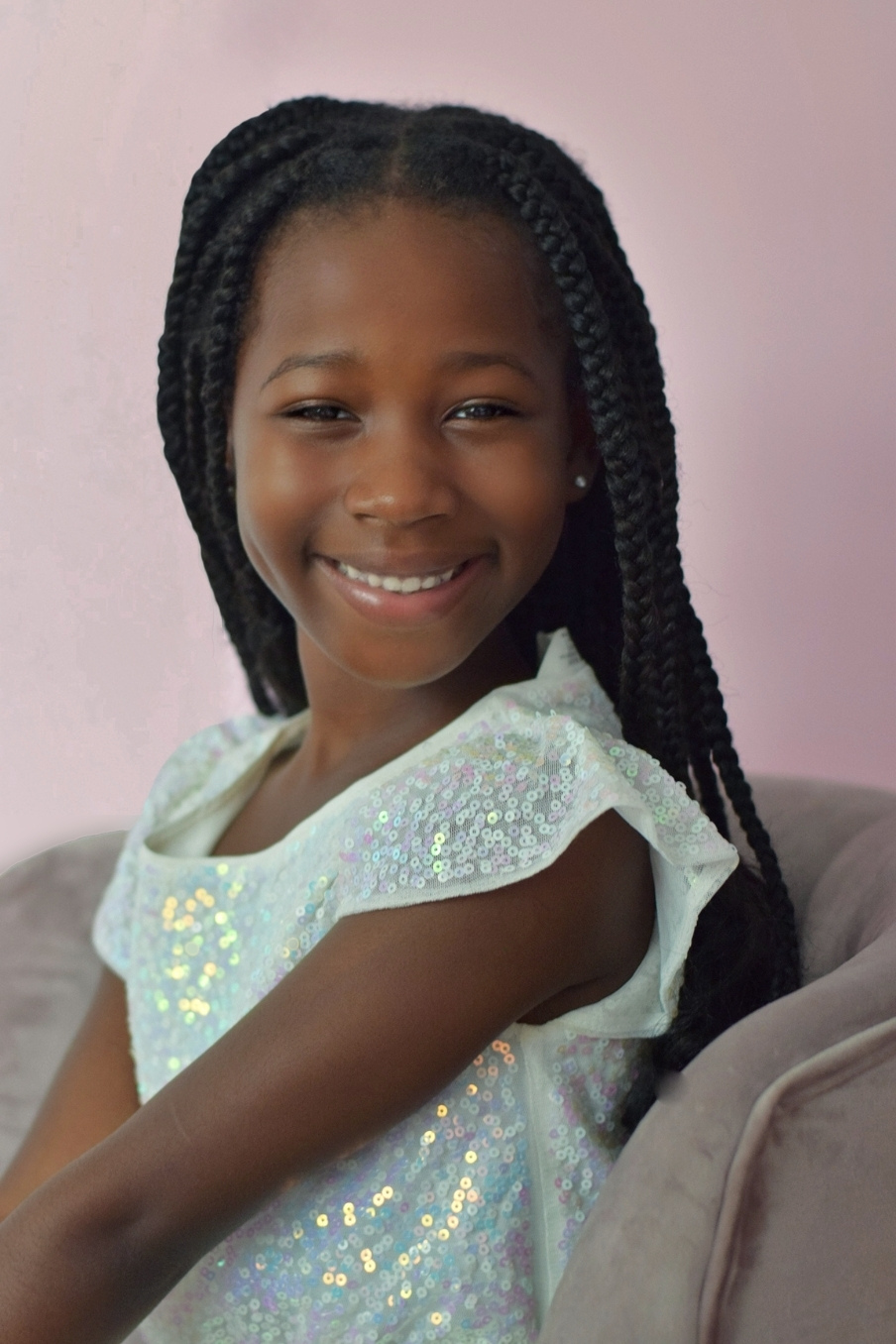 Portrait of 8 year old African-American girl smiling